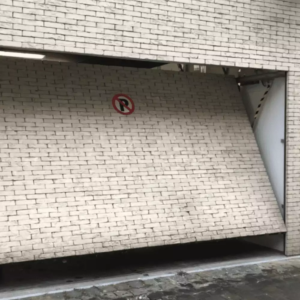 Porte de garage — 1 tonne de briques — 1